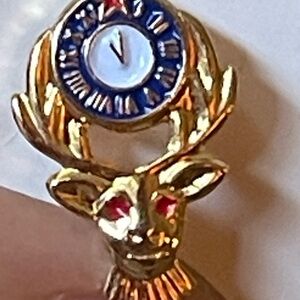 Gold Reindeer Brooch with Clock Design